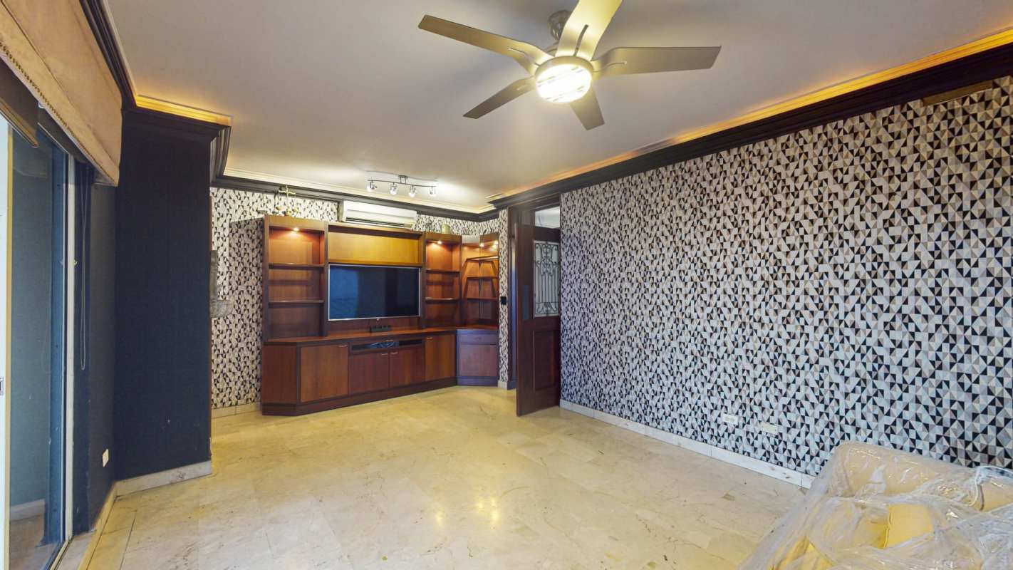 Spacious covered balcony overlooking El Cangrejo and skyline in duplex apartment