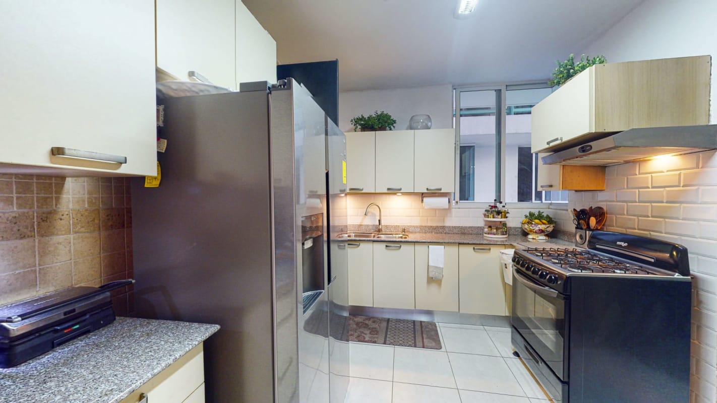 Kitchen in PH Bella Vista Park apartment with granite countertops and stainless steel appliances
