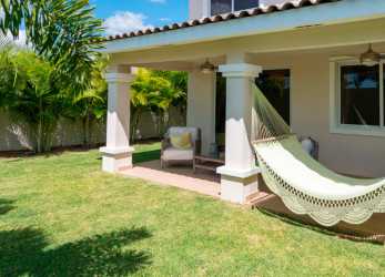 Two-story townhouse duplex with carport and private green lawn Bosques del Pacífico Panama