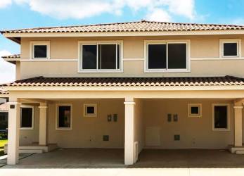 Two-story duplex with covered parking and Mediterranean styling at Bosques del Pacífico Panama