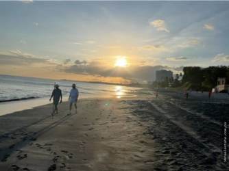 Private swimming pool with sun loungers and covered terrace in Coronado beach villa