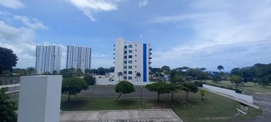Modern white multi-story condo tower in Playa Blanca Resort Panama