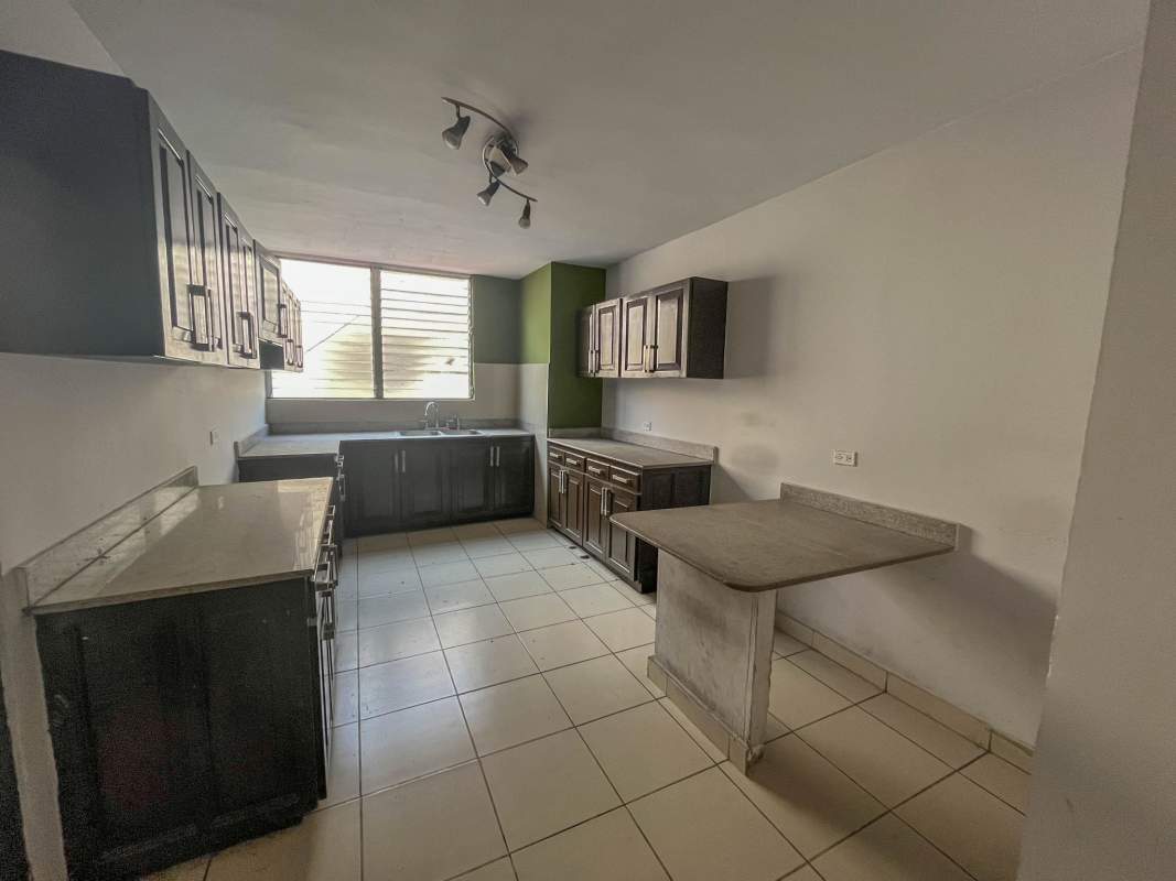 Bedroom space in PH Aileen with window AC slot and ample lighting in Panama City