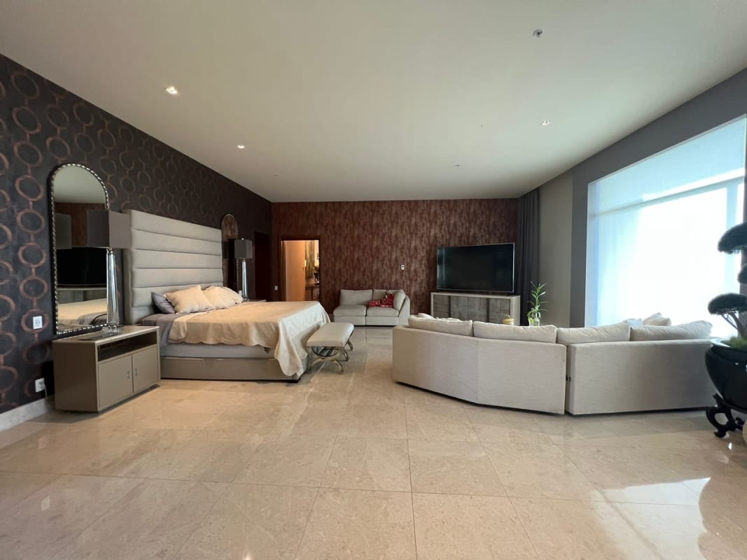 Modern luxury kitchen with marble countertops, island and top appliances in penthouse at PH Ocean Reef Panama