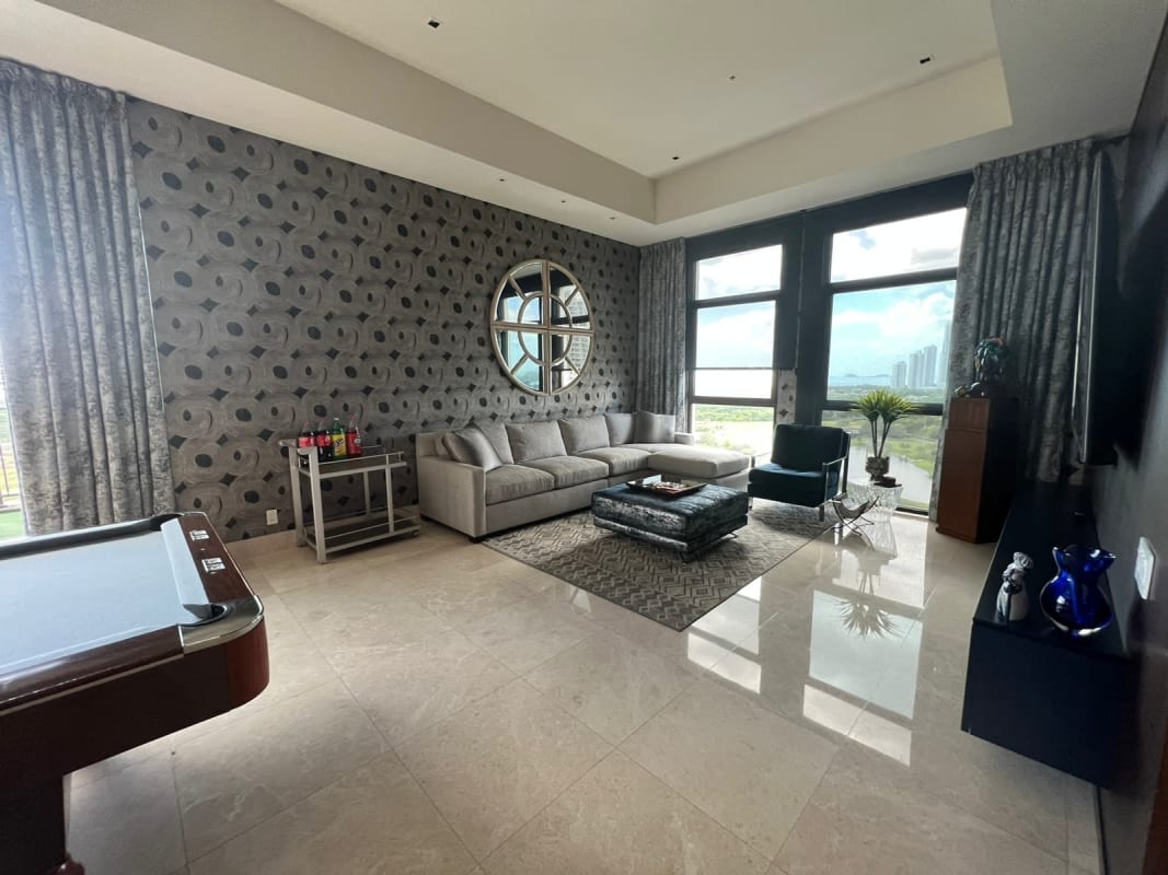 Family lounge entertainment area with panoramic skyline views PH Ocean House Santa Maria