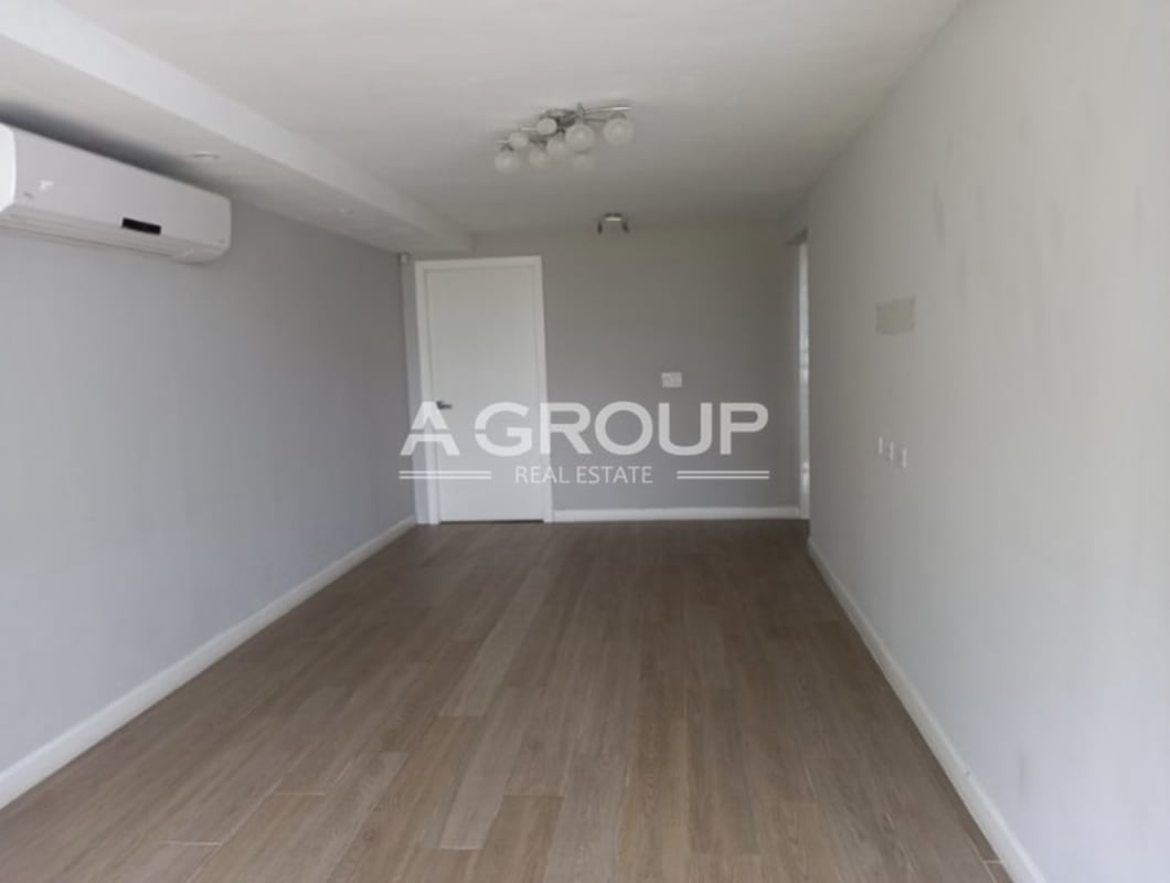 Modern living room with AC, wood flooring in luxury Punta Paitilla house Panama