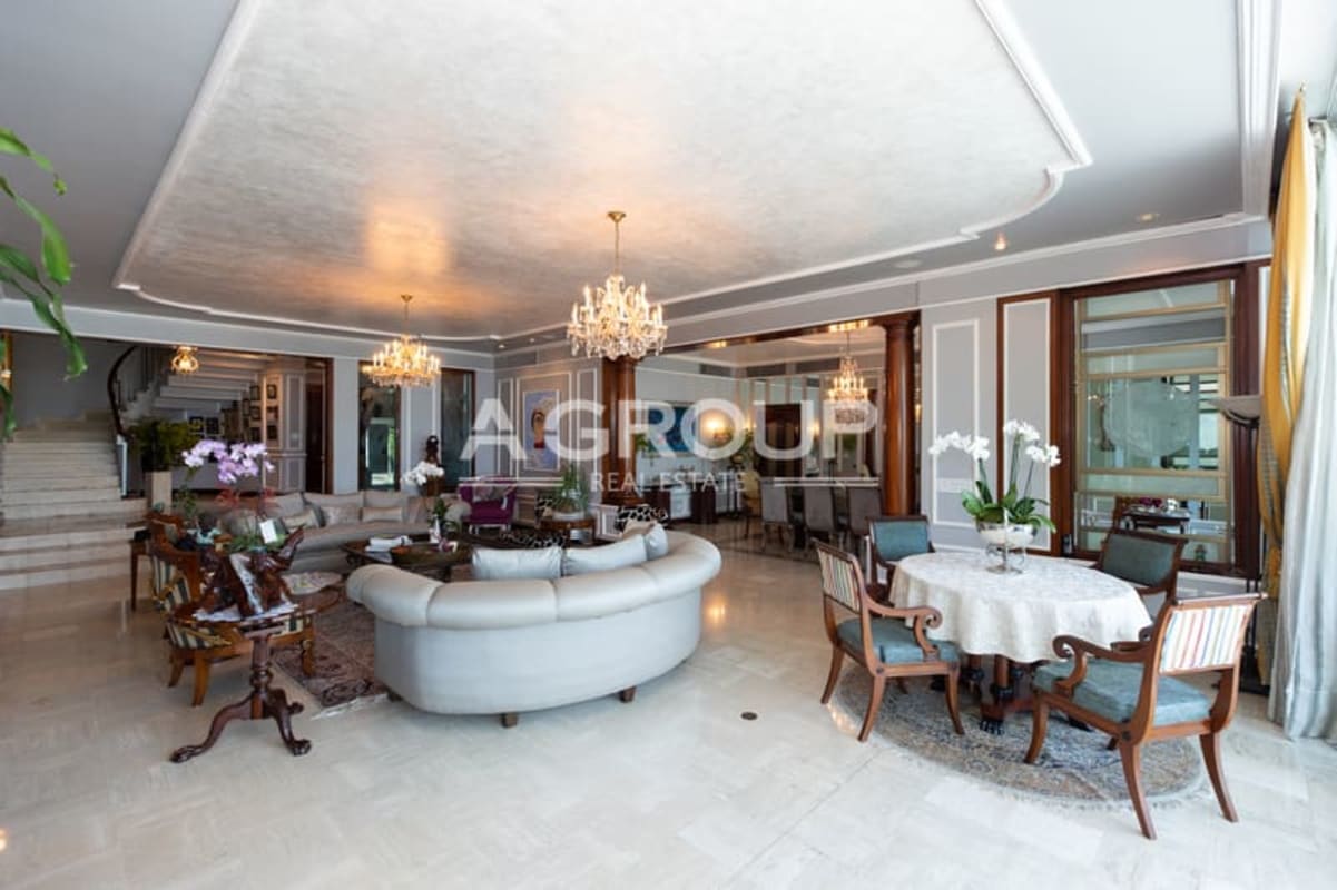 Spacious kitchen with granite island and wood cabinetry Punta Paitilla mansion Panama City