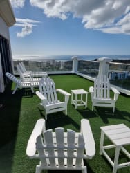 Bright living room floor-to-ceiling windows ocean marina views PH Las Olas Vistamar Panama