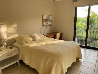 Modern open plan living and dining space with garden views in luxury Buenaventura condo Panama