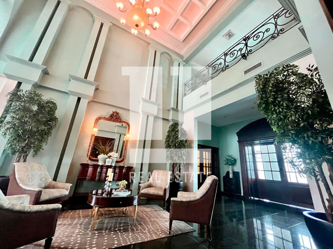 Elegant double-height entrance lobby chandelier classic details PH Coco del Mar Panama