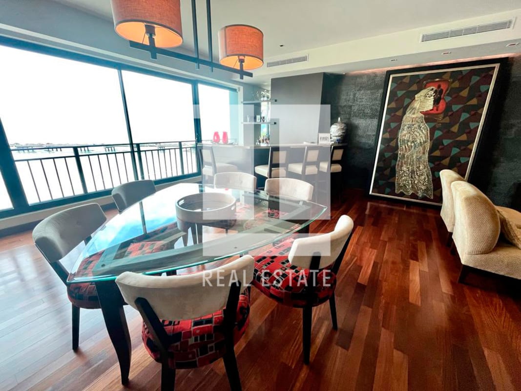 Modern dining room with ocean view windows at PH Coco del Mar luxury Panama City