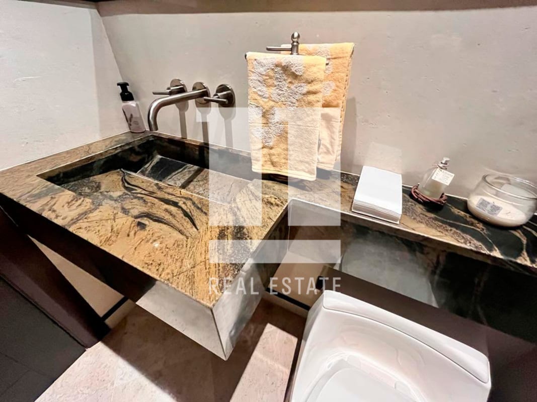 Spacious contemporary bedroom with built-in wardrobes and baby crib PH Coco del Mar Panama