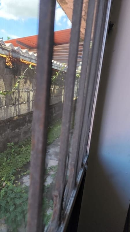 Spacious living room with tiled floors, glass doors, and natural light in house for sale Altos de Santa María Panama