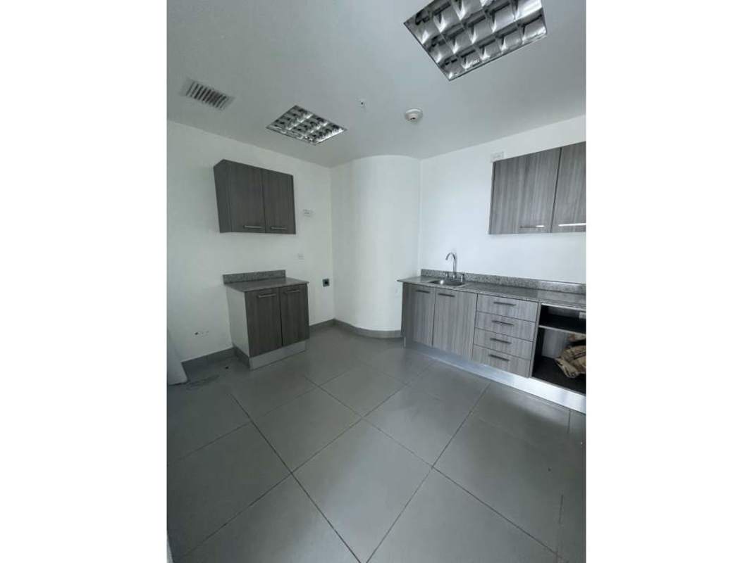Office kitchenette with granite counters and cabinets in Oceania Business Plaza Panama