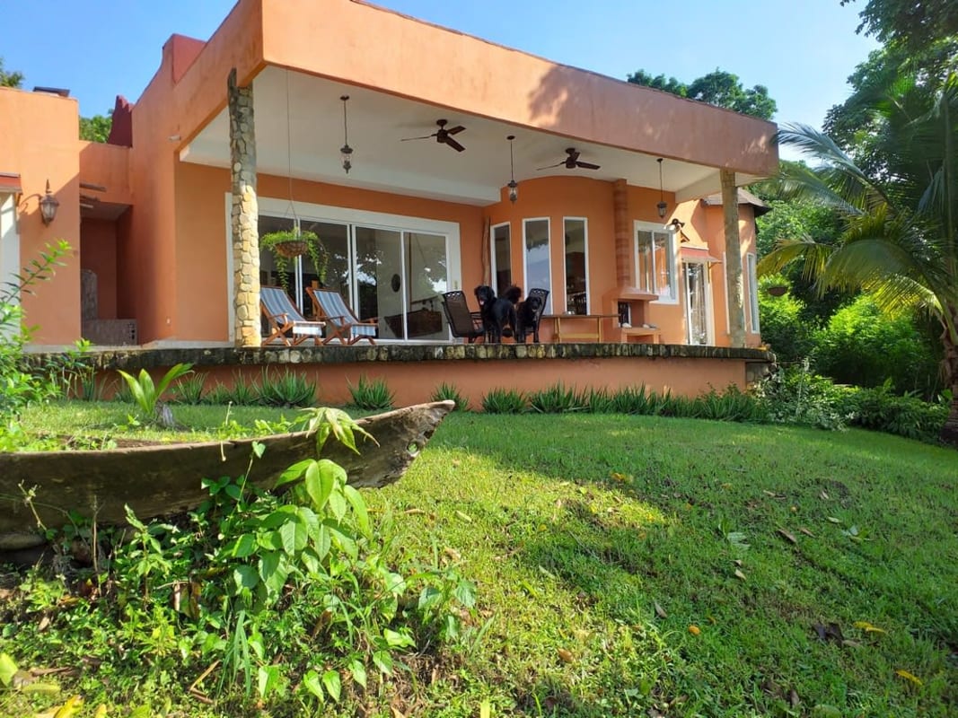 Lush tropical gardens with private beach and bay views at Isla Saboga Home Las Perlas Panama