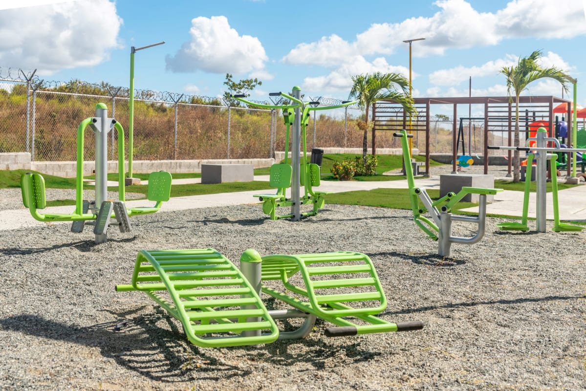 Community outdoor gym with fitness equipment and playground in Viñedo project Pacora Panama