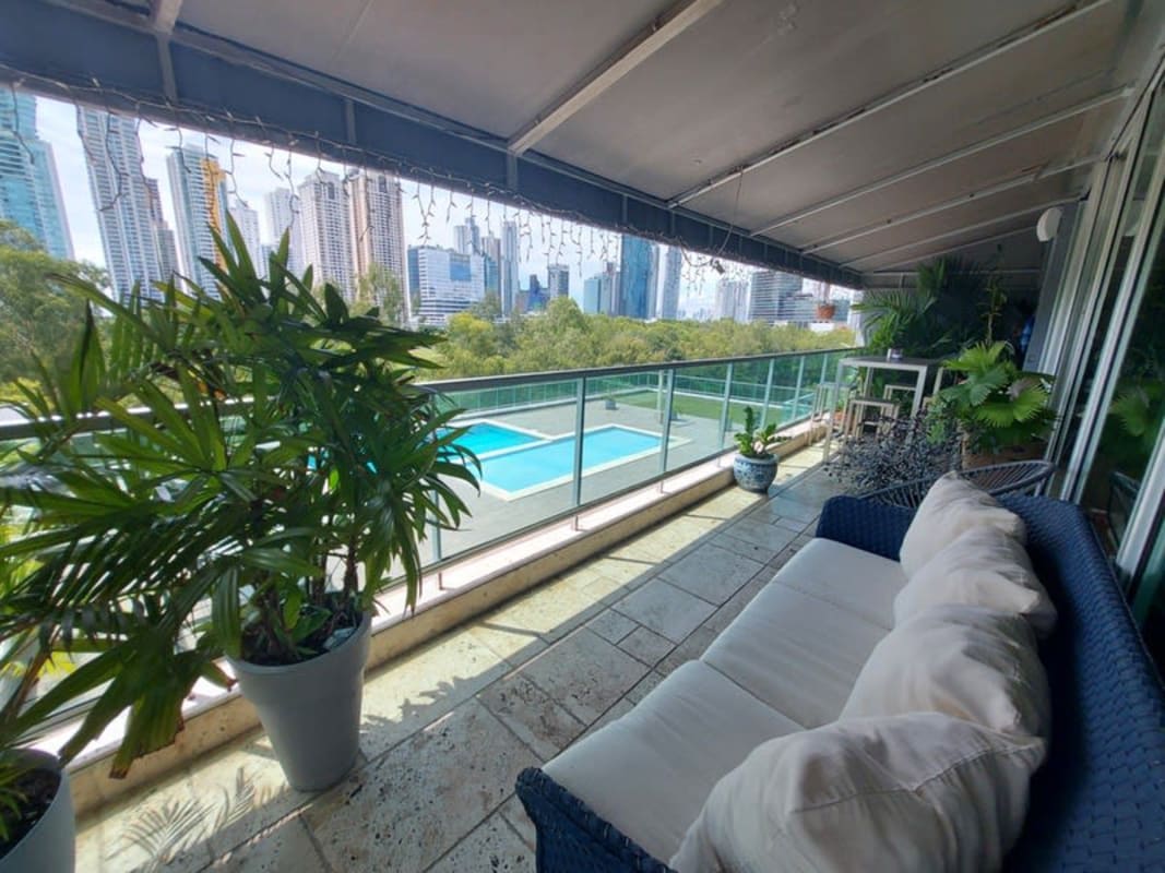 Spacious open-plan living room with large windows and terrace access PH Costa Real Costa del Este Panama