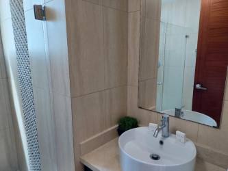 Aerial of Playa Blanca Resort lagoon, largest in Central America, white sand beach, ocean and towers