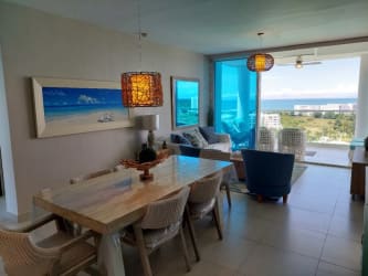Contemporary open kitchen with granite counters, stainless appliances, breakfast bar in PH Waterways Playa Blanca Panama