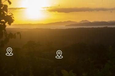 Scenic sunset over lush terrain, distant mountain ranges and sea Mariato Panama