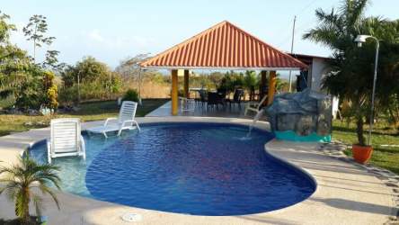 Swimming pool with waterfall lounge chairs and gazebo Las Uvas San Carlos Panama rental villa