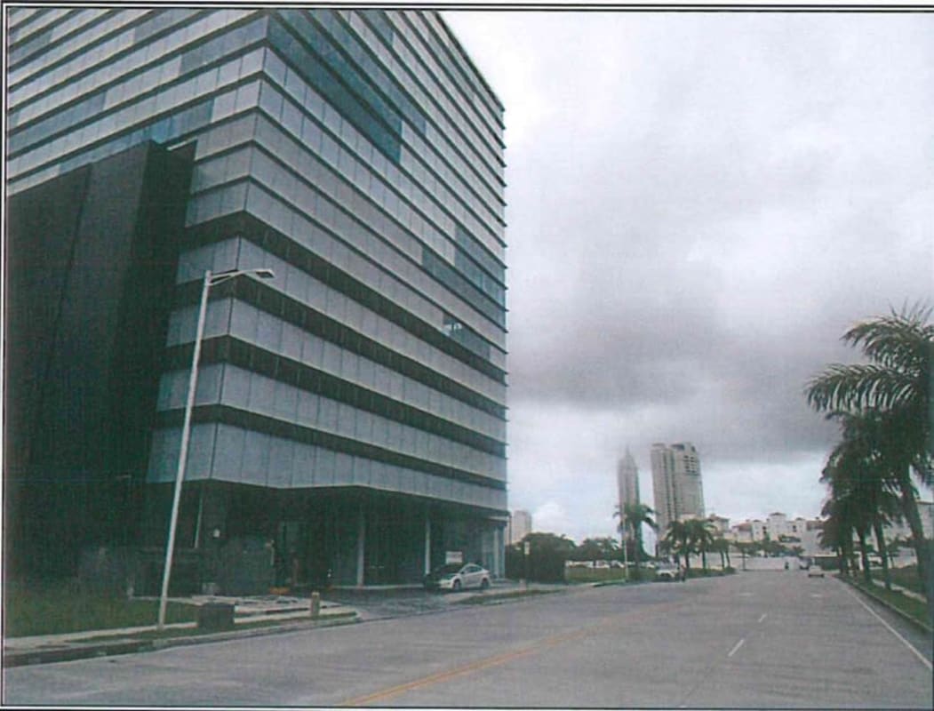 Contemporary glass office tower near vacant lot in Santa Maria Business District Panama