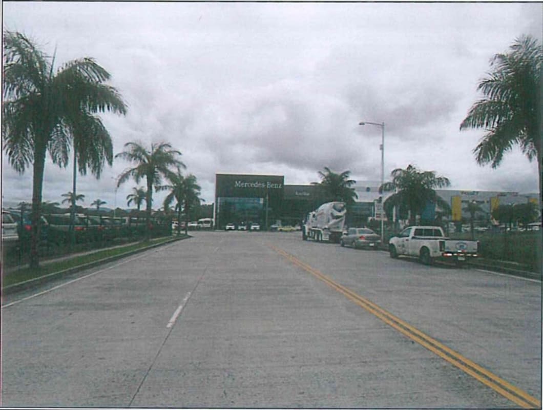 Commercial zone with parking, palm landscaping and businesses at Santa Maria Panama