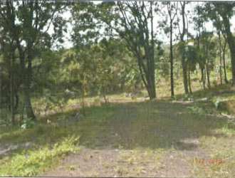 Roadside view of large land parcel with easy highway access and lush green surroundings in Bejuco Panama