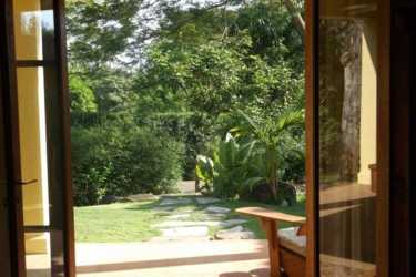 Bedroom with wood ceiling detail, fan, terrace access Azueros Ocean Loft Pedasi Panama
