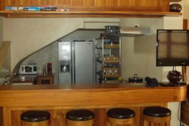 Interior space with open doors looking onto lush garden and stone path in Azueros Pedasi Panama