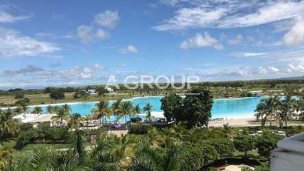Resort tropical landscaping with lagoon pool surrounded by palm trees in Playa Blanca Town Center