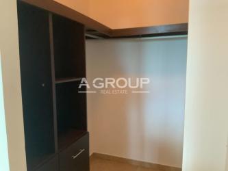 View of Playa Blanca Resort lagoon pool, palm trees and white sandy beachfront near Founders Tower III Panama