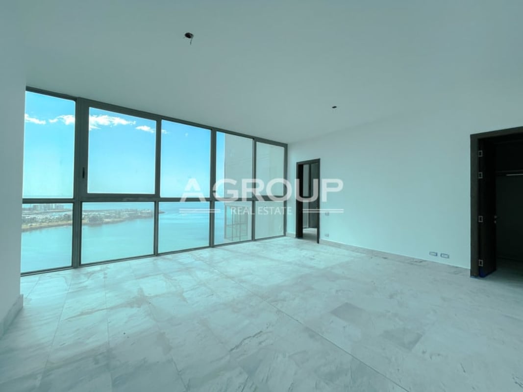 Luxury living-dining area with marble flooring and expansive city and ocean views in Sea Point Punta Paitilla