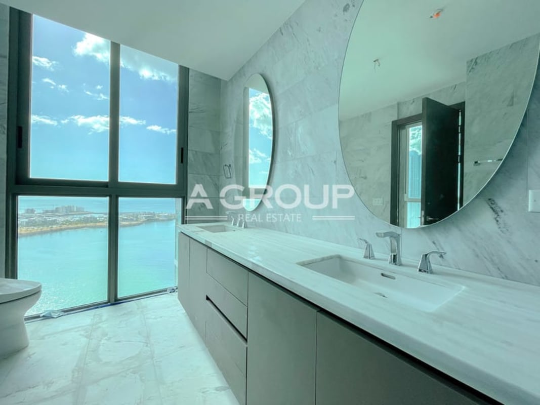 Double-height luxury lobby with marble floors, designer finishes, and ocean view in Sea Point Tower Panama
