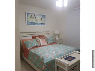 Contemporary living room with sliding doors to oceanview balcony at Casamar PH Perlamar San Carlos Panama