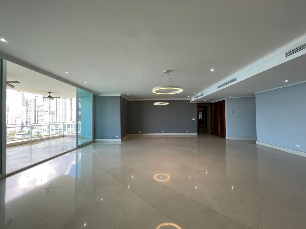 Elegant master bedroom with floor-to-ceiling windows and ocean outlook in Punta Pacífica