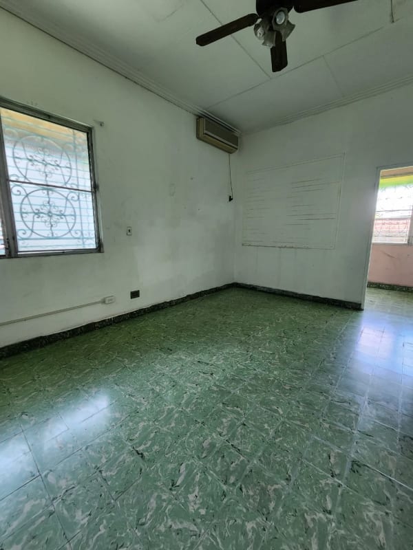 Bedroom with green tile floor, large window, closet, ceiling fan, Parque Lefevre Panama City