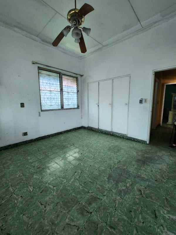 Bedroom with closet, window, AC, ceiling fan in Parque Lefevre Panama City home