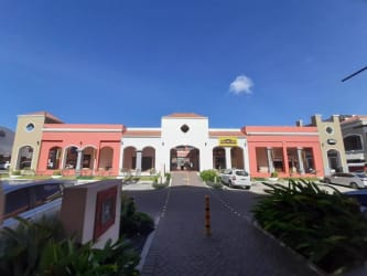 Mediterranean facade with arches shopping center entrance The Village Mall Nueva Gorgona