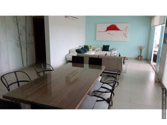 Palm trees, pool area and ocean view from Bijao Beach Club Panama