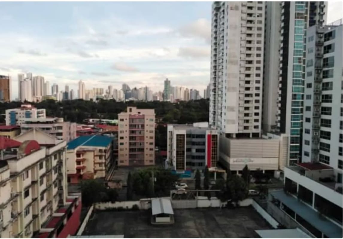 Empty bedroom or living space with large window city view in PH Parque Lefevre Panama City