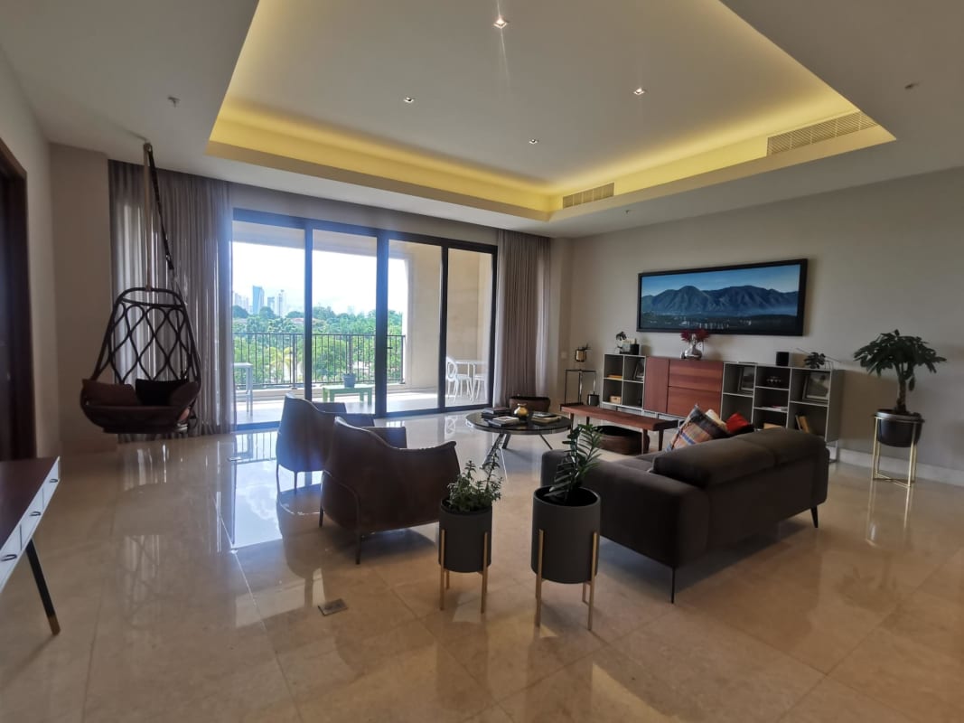 Expansive living area with floor-to-ceiling windows and golf course views at PH Santa Maria Court Panama