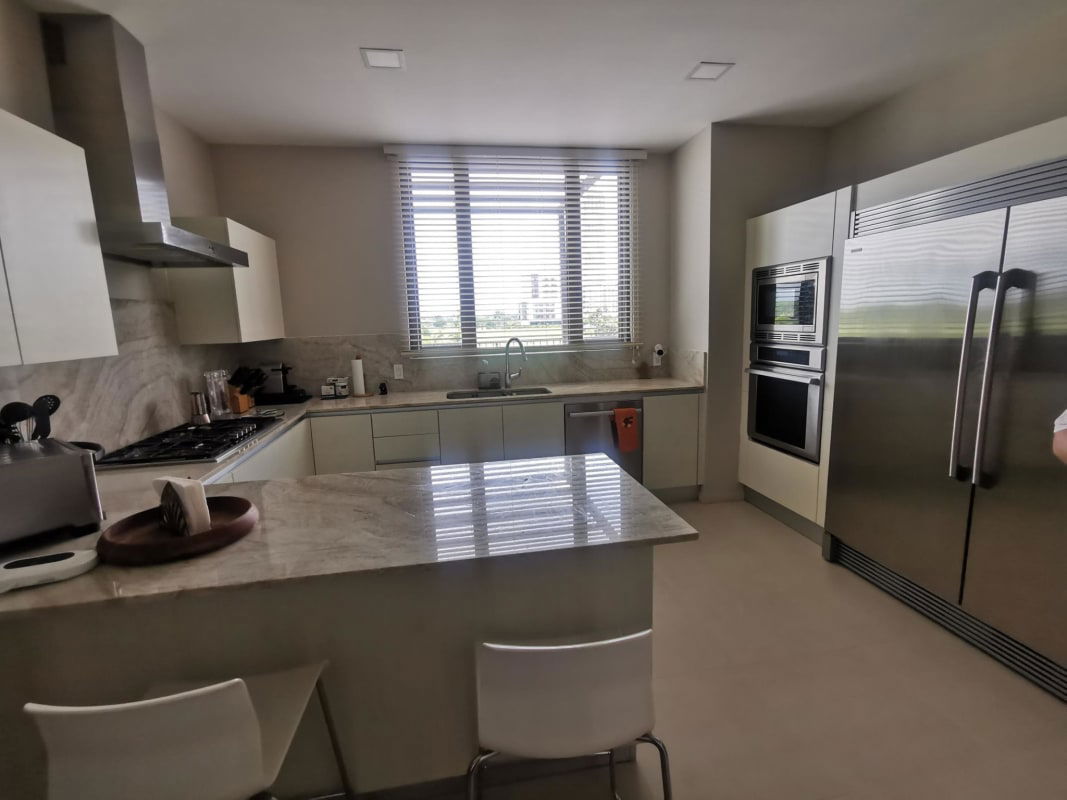 Master suite with large windows and access to terrace in PH Santa Maria Court Panama