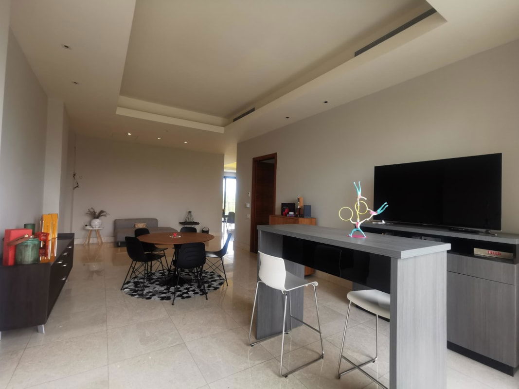 Designer marble bathroom with double sink and glass shower at PH Santa Maria Court Panama