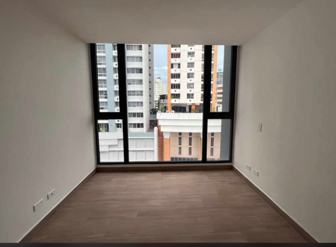 Open concept apartment with living, dining and kitchen areas, tile floors at PH Sky Swiss Panama City