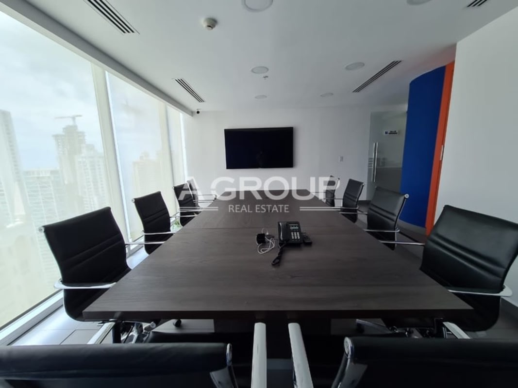 Glass-walled meeting room with panoramic city view Oceania Business Plaza Panama