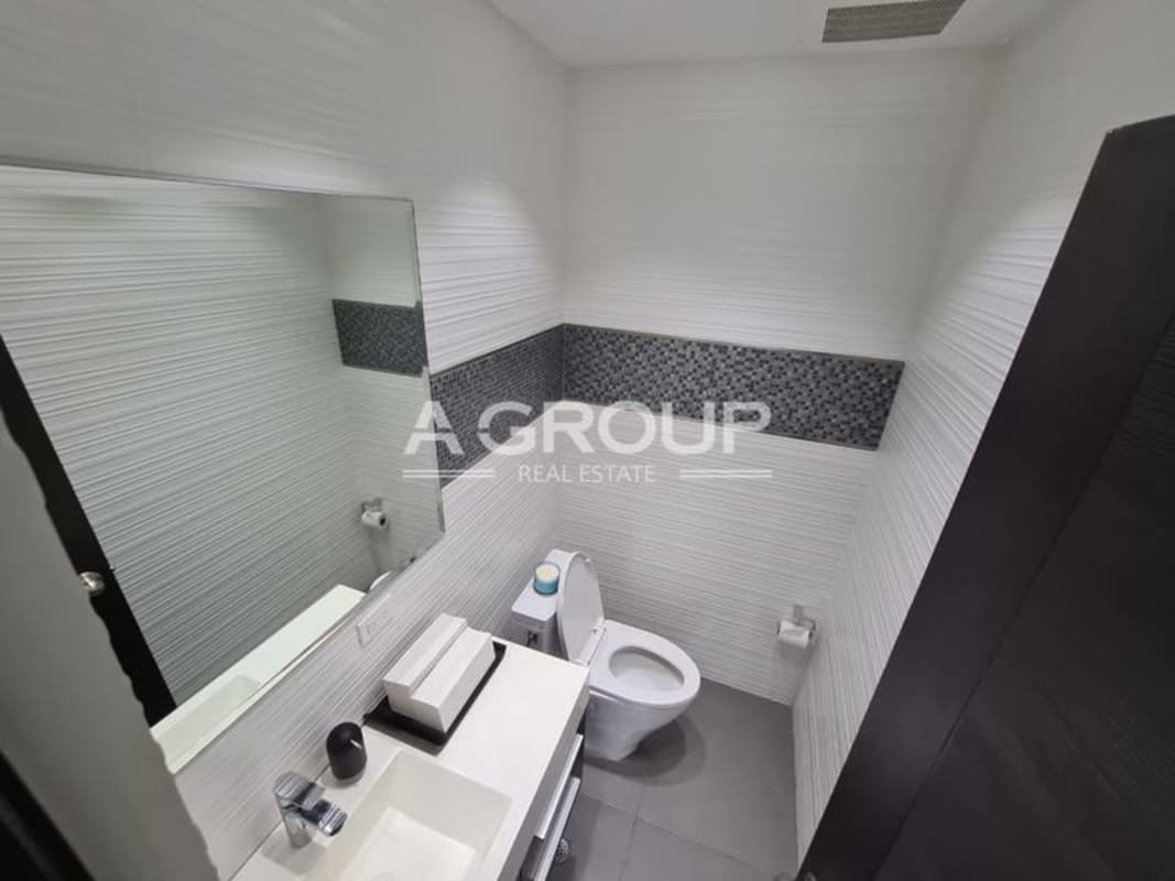 Modern internal restroom with sink and fixtures in Oceania Business Plaza office space