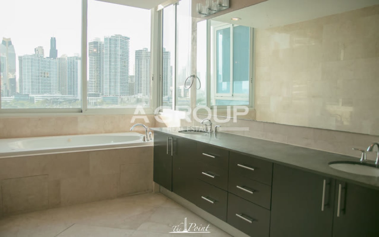 Granite countertop luxury kitchen with dark cabinets stainless appliances The Point Punta Paitilla Panama