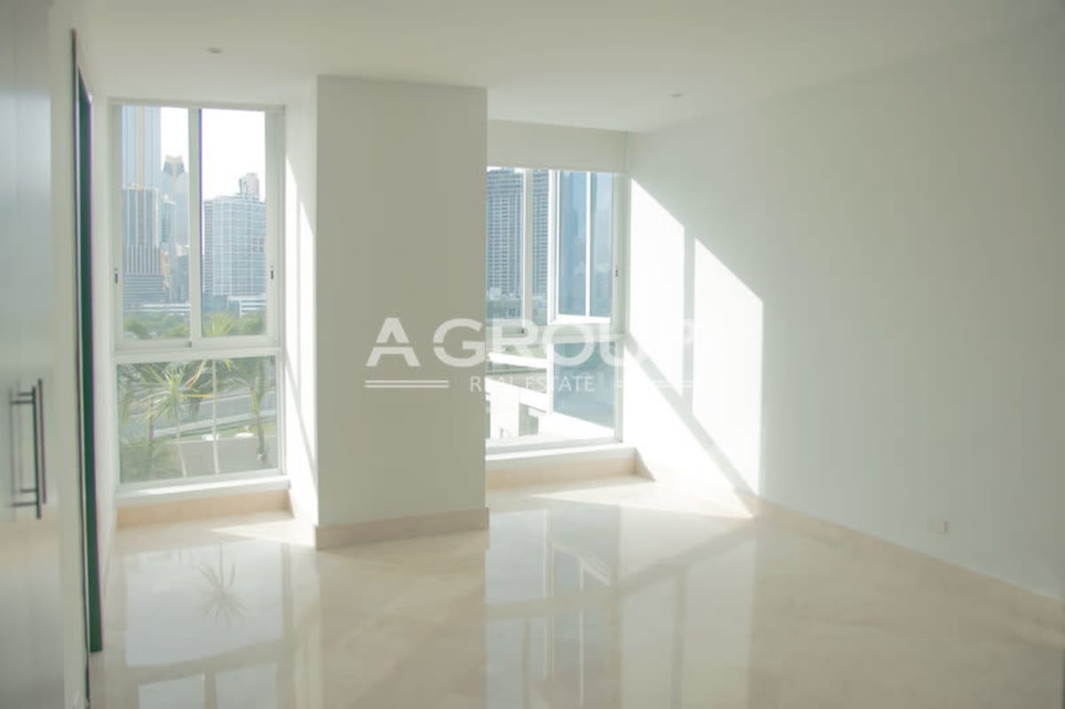 Modern granite countertop kitchen with dark cabinetry high-rise condo The Point Panama