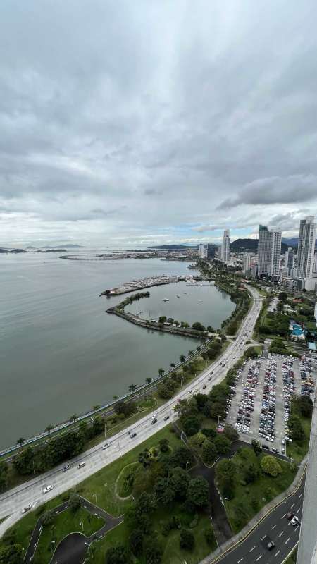Large master bedroom with floor to ceiling windows, private bathroom and ocean view at Yoo Panama Avenida Balboa